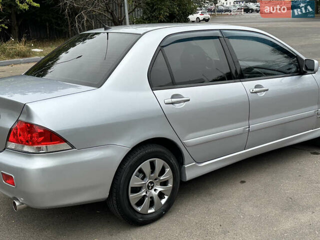 Серый Мицубиси Лансер, объемом двигателя 1.58 л и пробегом 183 тыс. км за 4800 $, фото 15 на Automoto.ua