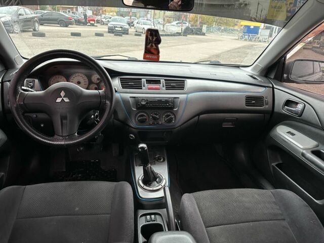 Серый Мицубиси Лансер, объемом двигателя 1.6 л и пробегом 250 тыс. км за 2550 $, фото 7 на Automoto.ua