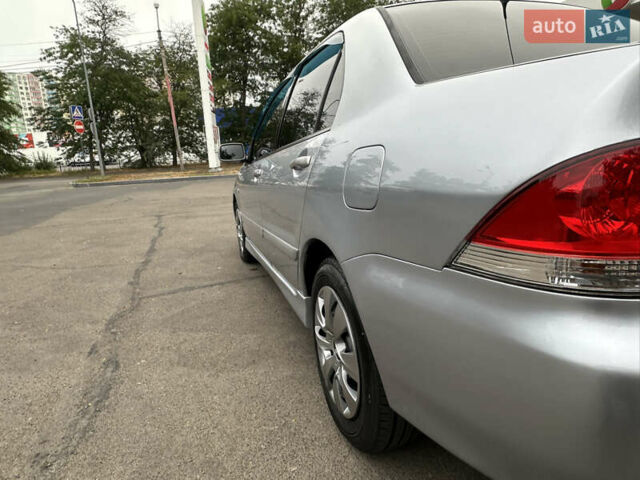 Серый Мицубиси Лансер, объемом двигателя 1.58 л и пробегом 183 тыс. км за 4800 $, фото 7 на Automoto.ua