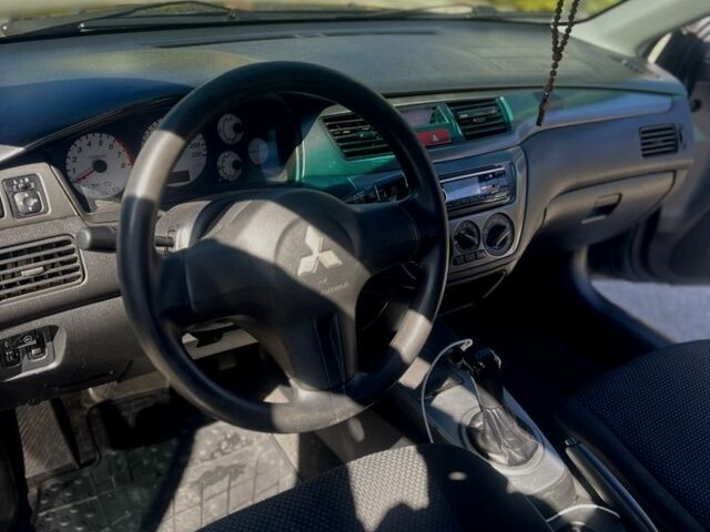 Серый Мицубиси Лансер, объемом двигателя 1.6 л и пробегом 284 тыс. км за 3500 $, фото 4 на Automoto.ua