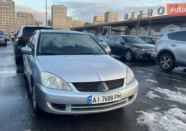 Серый Мицубиси Лансер, объемом двигателя 2 л и пробегом 307 тыс. км за 3999 $, фото 10 на Automoto.ua