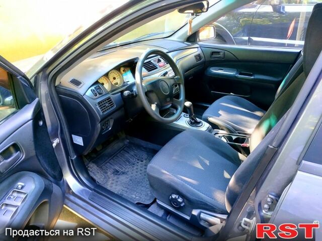 Серый Мицубиси Лансер, объемом двигателя 1.6 л и пробегом 177 тыс. км за 4000 $, фото 6 на Automoto.ua