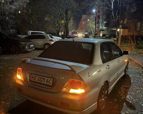 Серый Мицубиси Лансер, объемом двигателя 2 л и пробегом 256 тыс. км за 7000 $, фото 10 на Automoto.ua