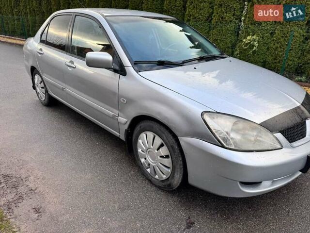 Сірий Міцубісі Lancer, об'ємом двигуна 1.58 л та пробігом 333 тис. км за 2999 $, фото 6 на Automoto.ua