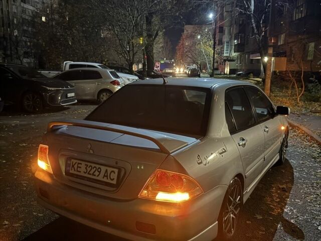 Серый Мицубиси Лансер, объемом двигателя 2 л и пробегом 256 тыс. км за 7000 $, фото 16 на Automoto.ua