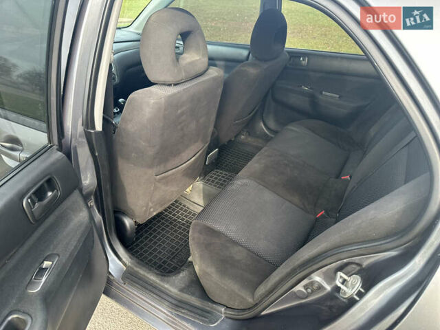 Сірий Міцубісі Lancer, об'ємом двигуна 1.58 л та пробігом 332 тис. км за 4650 $, фото 9 на Automoto.ua