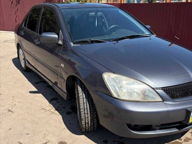 Сірий Міцубісі Lancer, об'ємом двигуна 1.6 л та пробігом 165 тис. км за 4302 $, фото 1 на Automoto.ua