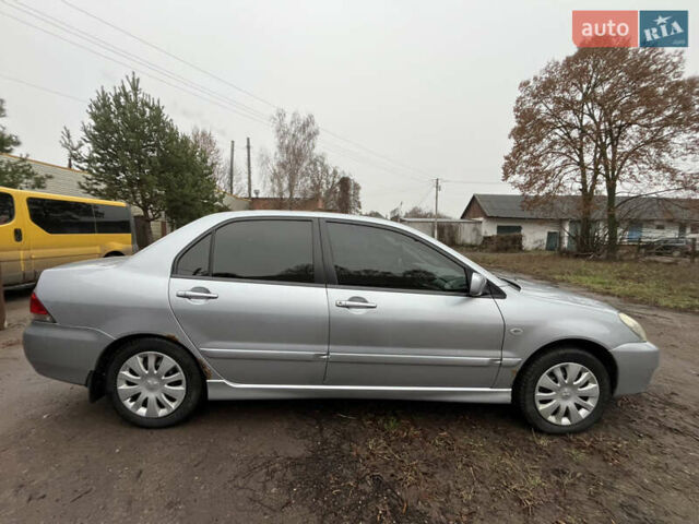 Сірий Міцубісі Lancer, об'ємом двигуна 1.58 л та пробігом 308 тис. км за 3700 $, фото 7 на Automoto.ua