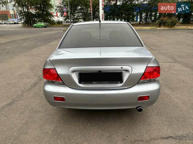 Серый Мицубиси Лансер, объемом двигателя 1.58 л и пробегом 183 тыс. км за 4800 $, фото 9 на Automoto.ua