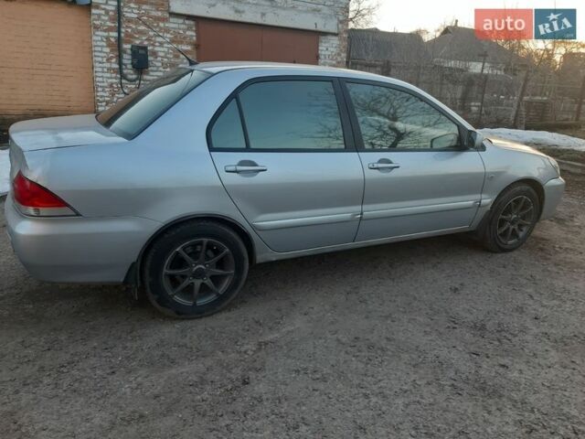 Серый Мицубиси Лансер, объемом двигателя 1.58 л и пробегом 187 тыс. км за 2699 $, фото 3 на Automoto.ua