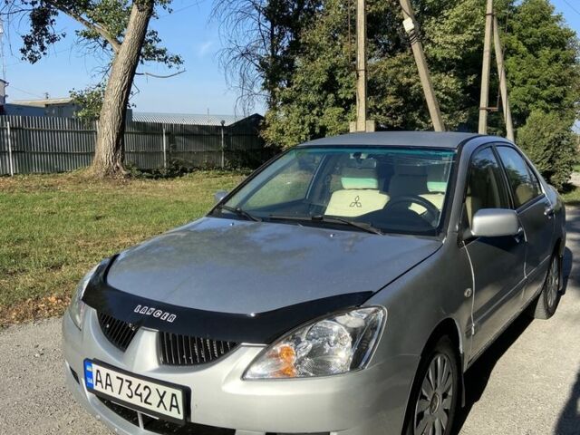 Серый Мицубиси Лансер, объемом двигателя 1.6 л и пробегом 275 тыс. км за 2900 $, фото 1 на Automoto.ua