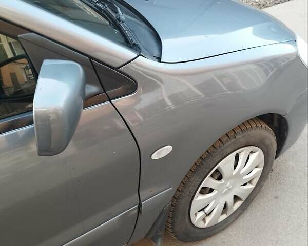 Сірий Міцубісі Lancer, об'ємом двигуна 1.58 л та пробігом 217 тис. км за 3500 $, фото 4 на Automoto.ua