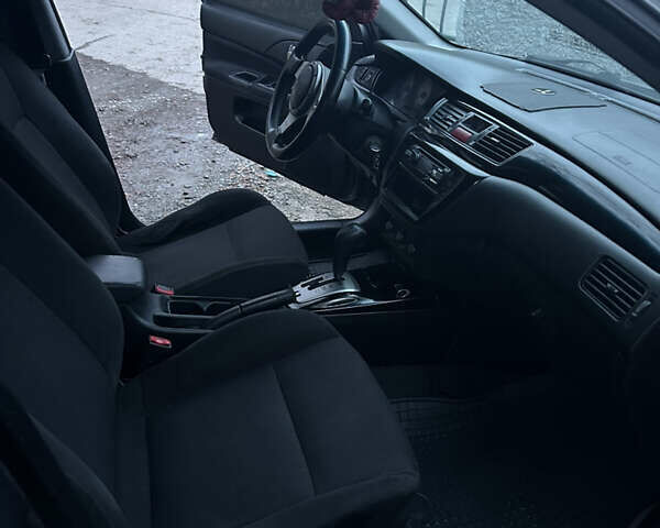 Сірий Міцубісі Lancer, об'ємом двигуна 2 л та пробігом 200 тис. км за 4999 $, фото 15 на Automoto.ua