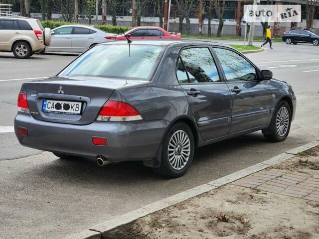 Сірий Міцубісі Lancer, об'ємом двигуна 1.6 л та пробігом 198 тис. км за 4900 $, фото 4 на Automoto.ua