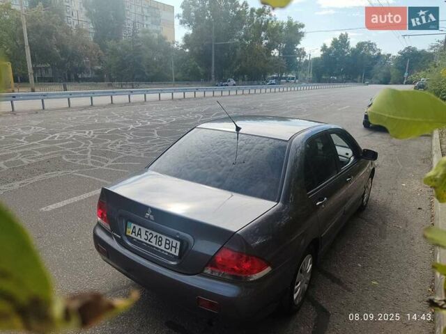 Сірий Міцубісі Lancer, об'ємом двигуна 1.6 л та пробігом 242 тис. км за 4900 $, фото 1 на Automoto.ua