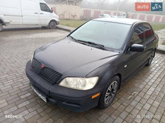 Сірий Міцубісі Lancer, об'ємом двигуна 2 л та пробігом 212 тис. км за 3333 $, фото 3 на Automoto.ua