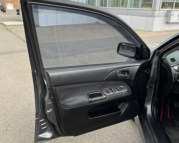 Сірий Міцубісі Lancer, об'ємом двигуна 1.6 л та пробігом 260 тис. км за 4998 $, фото 4 на Automoto.ua
