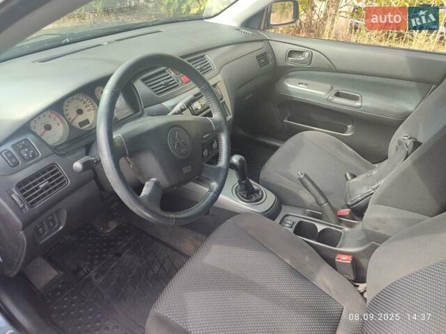 Сірий Міцубісі Lancer, об'ємом двигуна 1.6 л та пробігом 242 тис. км за 4900 $, фото 44 на Automoto.ua