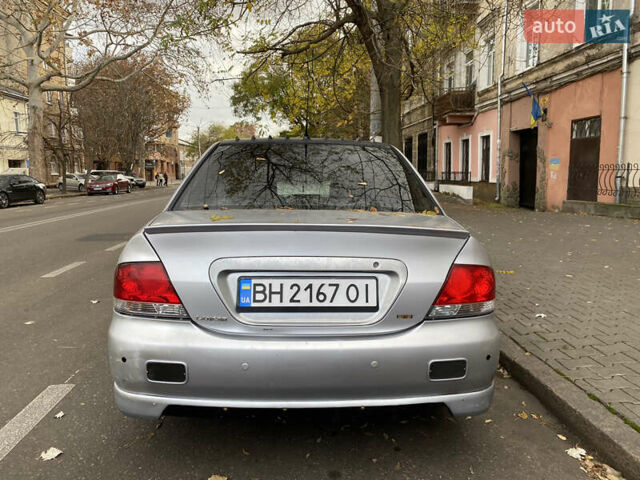 Серый Мицубиси Лансер, объемом двигателя 1.6 л и пробегом 444 тыс. км за 3400 $, фото 4 на Automoto.ua