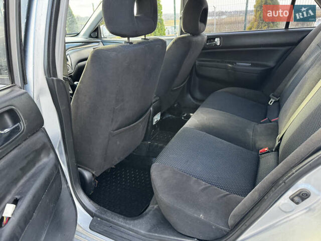 Сірий Міцубісі Lancer, об'ємом двигуна 1.58 л та пробігом 333 тис. км за 2999 $, фото 14 на Automoto.ua