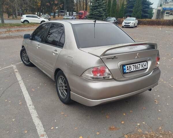 Сірий Міцубісі Lancer, об'ємом двигуна 2 л та пробігом 330 тис. км за 3450 $, фото 4 на Automoto.ua