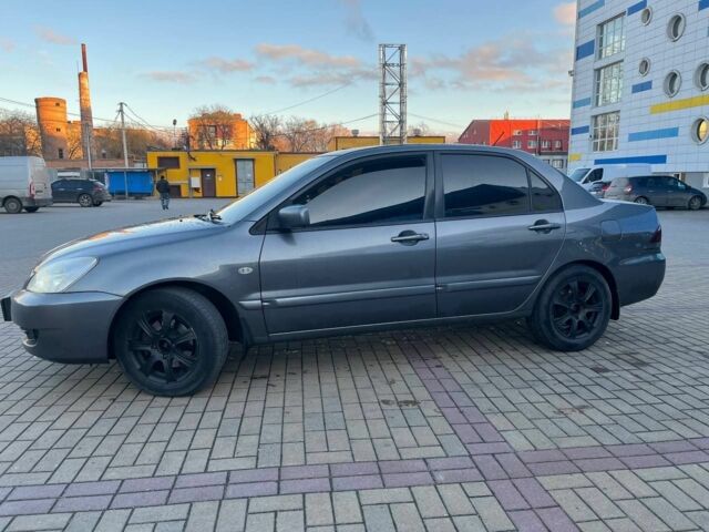 Серый Мицубиси Лансер, объемом двигателя 1.6 л и пробегом 279 тыс. км за 3990 $, фото 3 на Automoto.ua