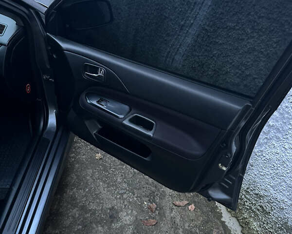 Сірий Міцубісі Lancer, об'ємом двигуна 2 л та пробігом 200 тис. км за 4999 $, фото 18 на Automoto.ua