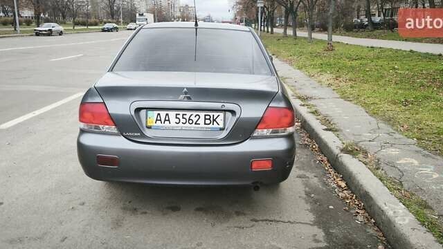Серый Мицубиси Лансер, объемом двигателя 1.6 л и пробегом 263 тыс. км за 3650 $, фото 7 на Automoto.ua