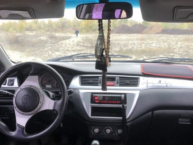 Міцубісі Lancer 2006 у Синельниковом на Automoto.ua Сірий Міцубісі Lancer, об'ємом двигуна 2 л та пробігом 200 тис. км за 3000 $, фото 5 на Automoto.ua