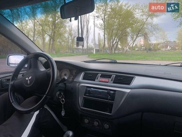 Серый Мицубиси Лансер, объемом двигателя 1.6 л и пробегом 195 тыс. км за 4800 $, фото 8 на Automoto.ua