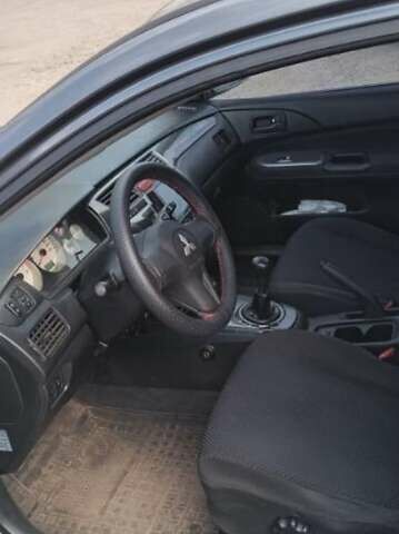 Серый Мицубиси Лансер, объемом двигателя 1.58 л и пробегом 271 тыс. км за 4600 $, фото 7 на Automoto.ua