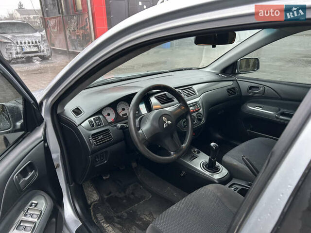 Сірий Міцубісі Lancer, об'ємом двигуна 1.6 л та пробігом 223 тис. км за 3900 $, фото 11 на Automoto.ua
