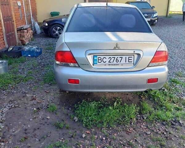 Серый Мицубиси Лансер, объемом двигателя 1.6 л и пробегом 148 тыс. км за 4500 $, фото 1 на Automoto.ua