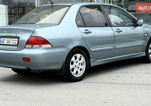 Сірий Міцубісі Lancer, об'ємом двигуна 1.58 л та пробігом 275 тис. км за 4600 $, фото 5 на Automoto.ua
