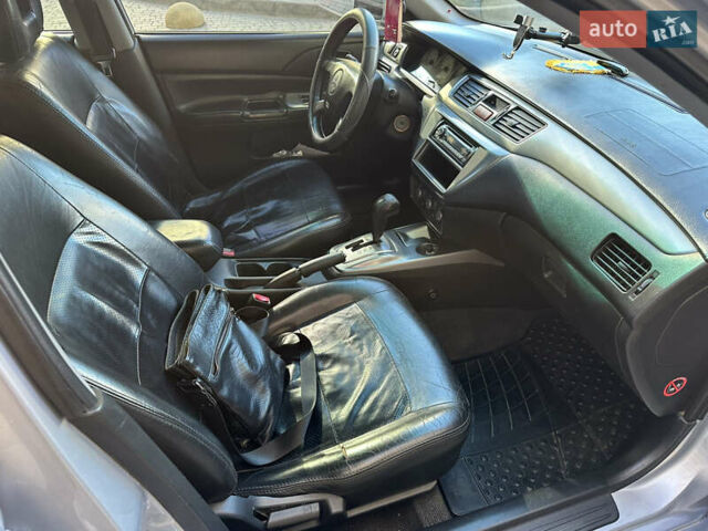 Серый Мицубиси Лансер, объемом двигателя 1.58 л и пробегом 244 тыс. км за 4950 $, фото 10 на Automoto.ua