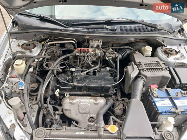 Серый Мицубиси Лансер, объемом двигателя 1.58 л и пробегом 215 тыс. км за 4000 $, фото 11 на Automoto.ua