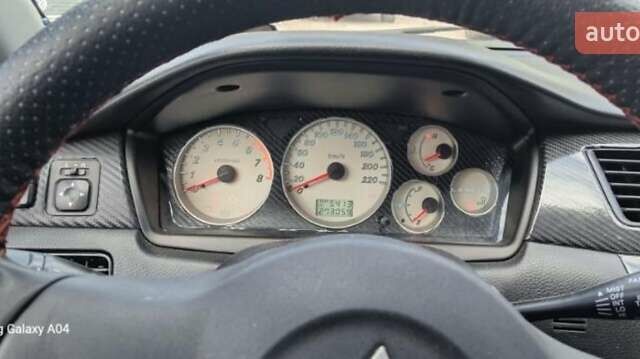 Серый Мицубиси Лансер, объемом двигателя 1.58 л и пробегом 271 тыс. км за 4600 $, фото 4 на Automoto.ua