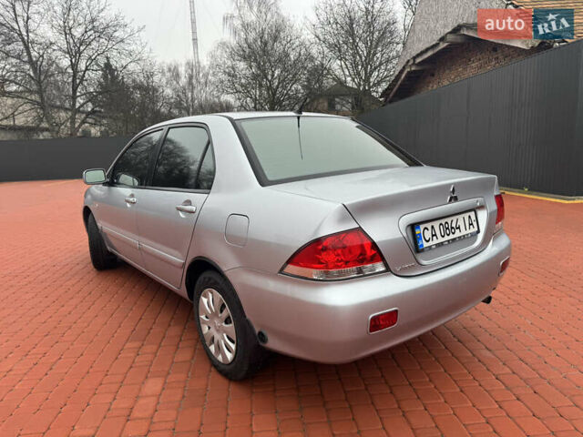 Серый Мицубиси Лансер, объемом двигателя 1.6 л и пробегом 242 тыс. км за 4300 $, фото 4 на Automoto.ua