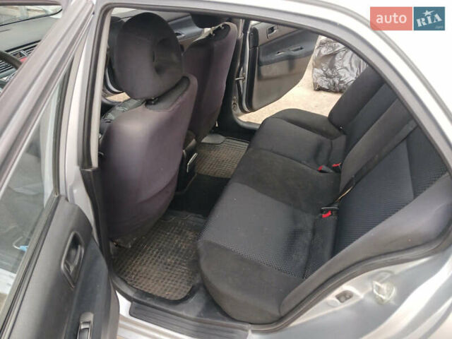 Серый Мицубиси Лансер, объемом двигателя 1.58 л и пробегом 215 тыс. км за 4000 $, фото 13 на Automoto.ua