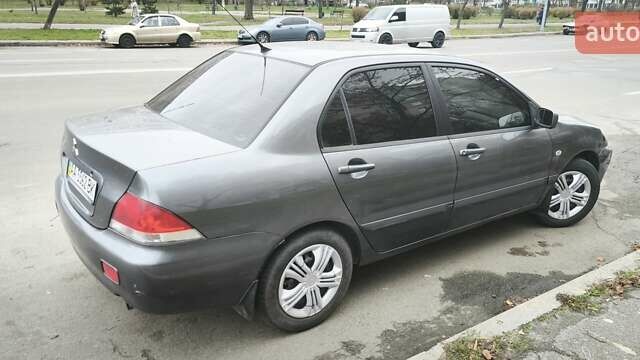 Серый Мицубиси Лансер, объемом двигателя 1.6 л и пробегом 263 тыс. км за 3650 $, фото 6 на Automoto.ua