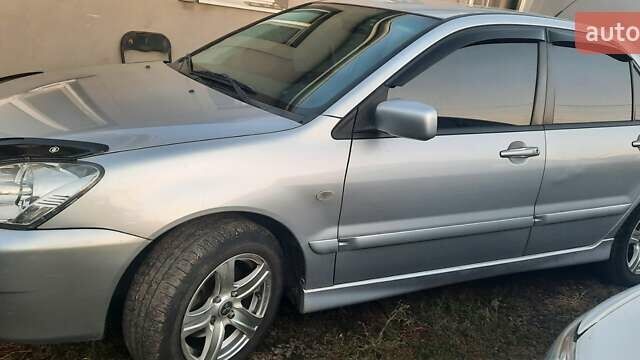 Сірий Міцубісі Lancer, об'ємом двигуна 1.58 л та пробігом 238 тис. км за 5000 $, фото 11 на Automoto.ua