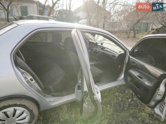 Серый Мицубиси Лансер, объемом двигателя 1.6 л и пробегом 234 тыс. км за 4300 $, фото 3 на Automoto.ua