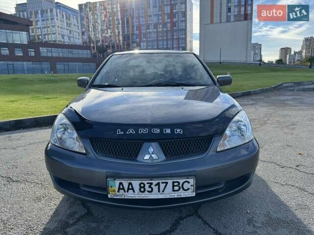 Сірий Міцубісі Lancer, об'ємом двигуна 1.58 л та пробігом 276 тис. км за 3650 $, фото 5 на Automoto.ua
