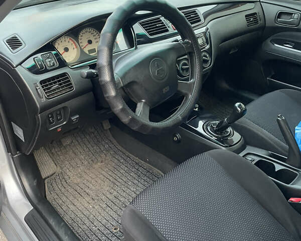 Сірий Міцубісі Lancer, об'ємом двигуна 1.58 л та пробігом 430 тис. км за 2550 $, фото 15 на Automoto.ua