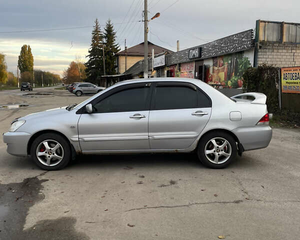 Сірий Міцубісі Lancer, об'ємом двигуна 1.58 л та пробігом 430 тис. км за 2550 $, фото 3 на Automoto.ua