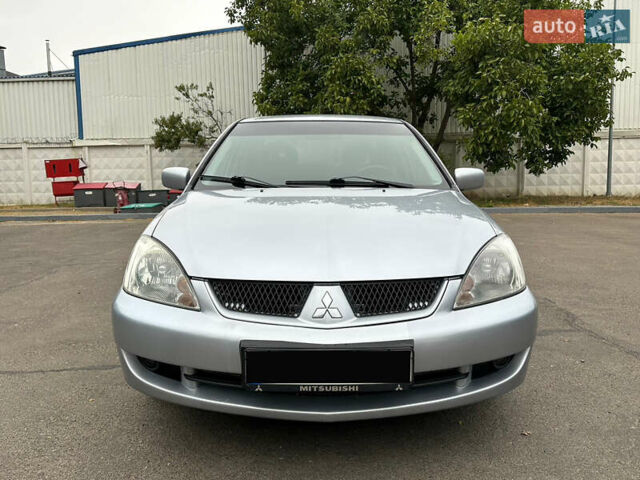 Серый Мицубиси Лансер, объемом двигателя 1.58 л и пробегом 183 тыс. км за 4800 $, фото 3 на Automoto.ua