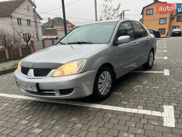 Сірий Міцубісі Lancer, об'ємом двигуна 1.58 л та пробігом 333 тис. км за 2450 $, фото 6 на Automoto.ua