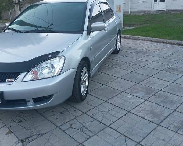 Мицубиси Лансер 2006 в Каменское - Днепродзержинск на Automoto.ua Серый Мицубиси Лансер, объемом двигателя 1.58 л и пробегом 238 тыс. км за 5400 $, фото 8 на Automoto.ua