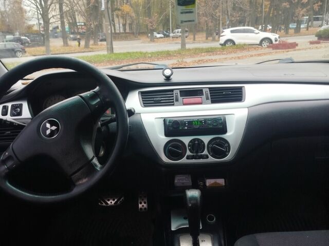 Сірий Міцубісі Lancer, об'ємом двигуна 2 л та пробігом 330 тис. км за 3450 $, фото 3 на Automoto.ua