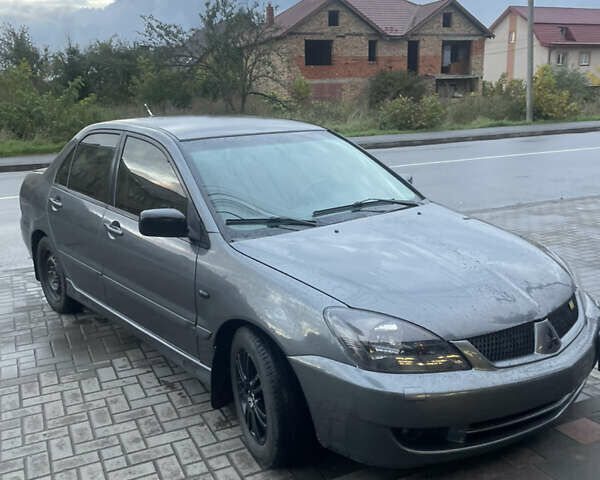 Сірий Міцубісі Lancer, об'ємом двигуна 1.6 л та пробігом 244 тис. км за 2999 $, фото 2 на Automoto.ua